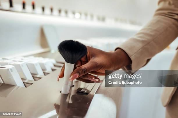 buying  face brush - cosmetics shopping stock pictures, royalty-free photos & images