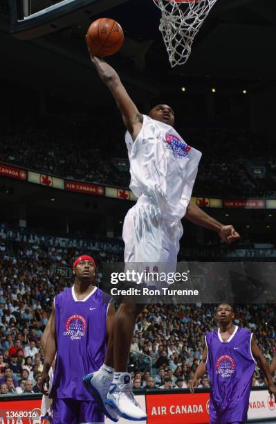 Jerry Stackhouse of the Detroit Pistons goes up for a slam dunk during the Vince Carter Charity All Star Game at the Air Canada Centre in Toronto,...
