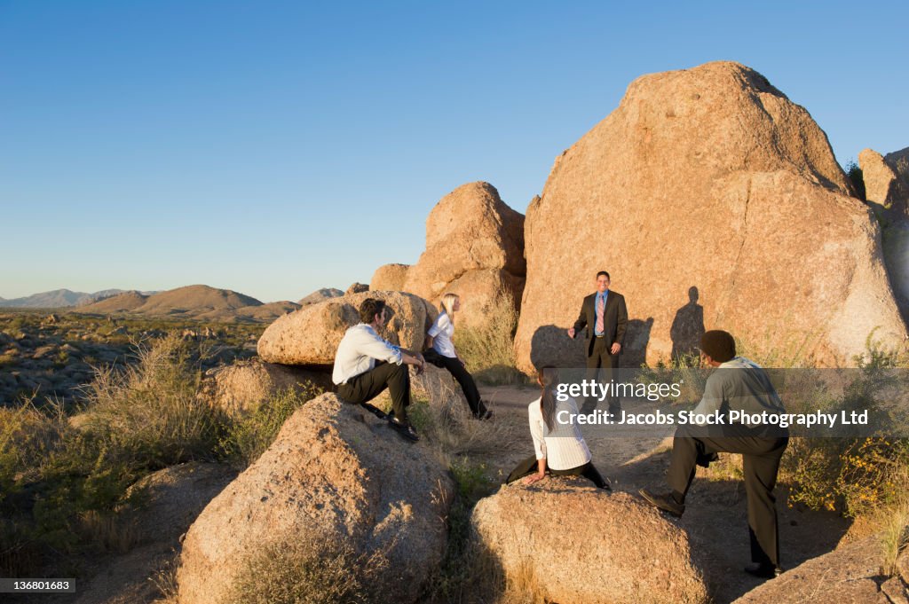 Business people having a meeting in the desert