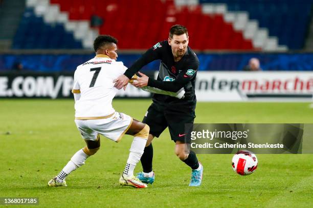 Lionel Messi of Paris Saint-Germain tries to control the ball against Hicham Boudaoui of OGC Nice during the French Cup match between Paris and Nice...