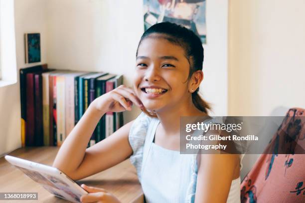 girl using tablet - daily life in philippines stock pictures, royalty-free photos & images