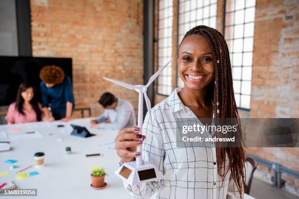 wind energy - woman making project - african american women in the wind stock pictures, royalty-free photos & images