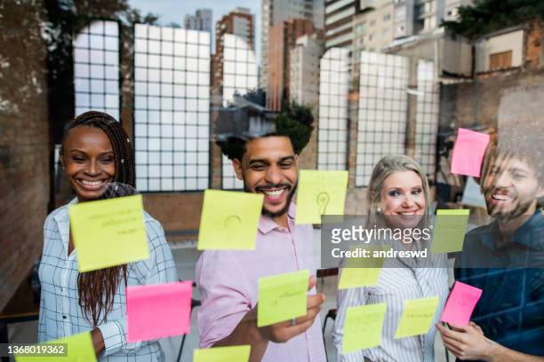 brainstorm - diversity work team - group people thinking stock pictures, royalty-free photos & images