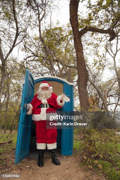 santa leaving portable toilet - overweight 40 year old male concerned stock pictures, royalty-free photos & images