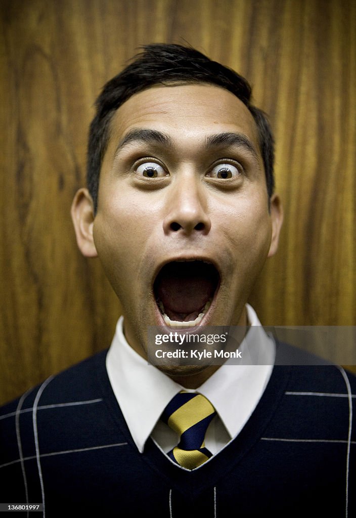 Shouting mixed race businessman