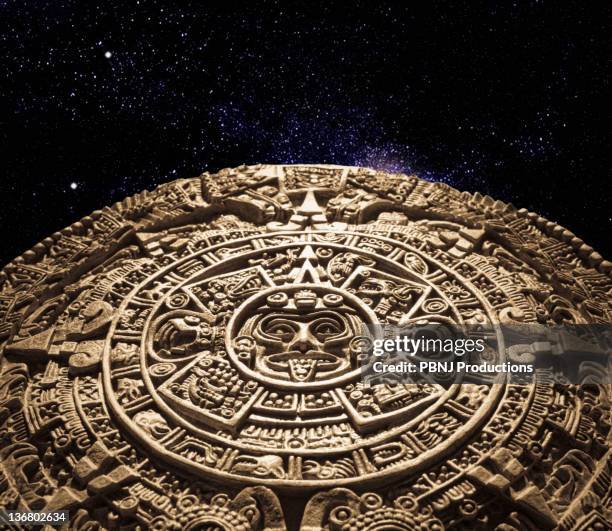 aztec calendar stone carving in space - calendario azteca fotografías e imágenes de stock