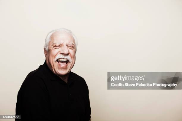 laughing senior man - mustache isolated stock-fotos und bilder