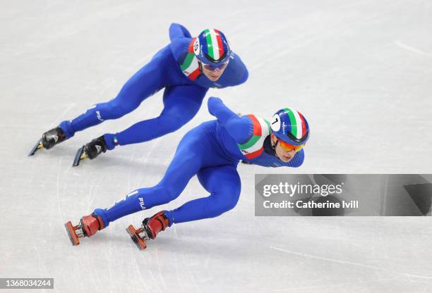 Pietro Sighel and Luca Spechenhauser of Team Italy skate during a short track speed skating practice session ahead of the Beijing 2022 Winter Olympic...