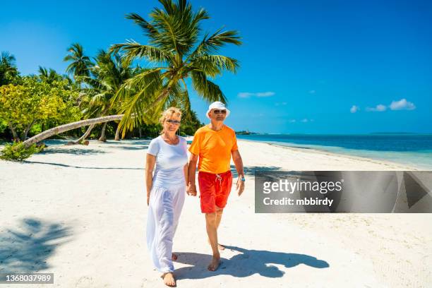 senior couple enjoying holidays at maldives, herathera island, addu atoll - aged to perfection stock pictures, royalty-free photos & images