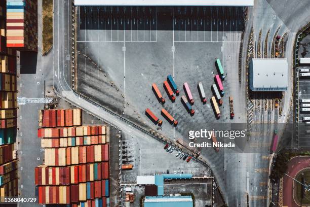 top view of container ship terminal with trucks in shenzhen, china - shenzhen stock pictures, royalty-free photos & images