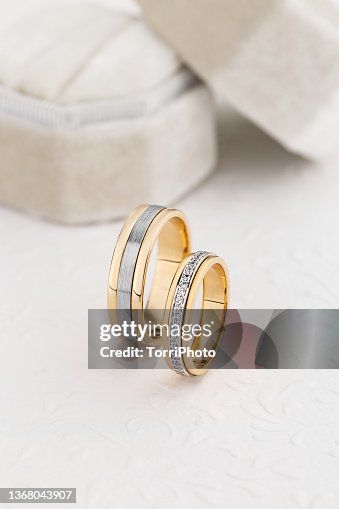 Pair of unique wedding rings with diamond on white background Pair of unique wedding rings with diamond on white background