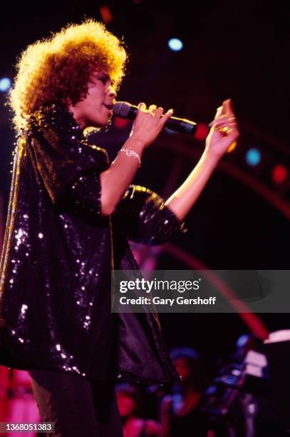 American Pop and R&B singer Whitney Houston performs onstage at Jones Beach Theatre, Wantagh, New York, August 2, 1986.