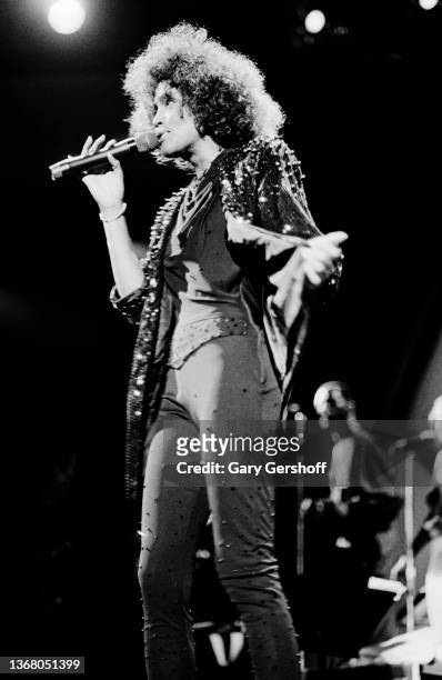 American Pop and R&B singer Whitney Houston performs onstage at Jones Beach Theatre, Wantagh, New York, August 2, 1986.
