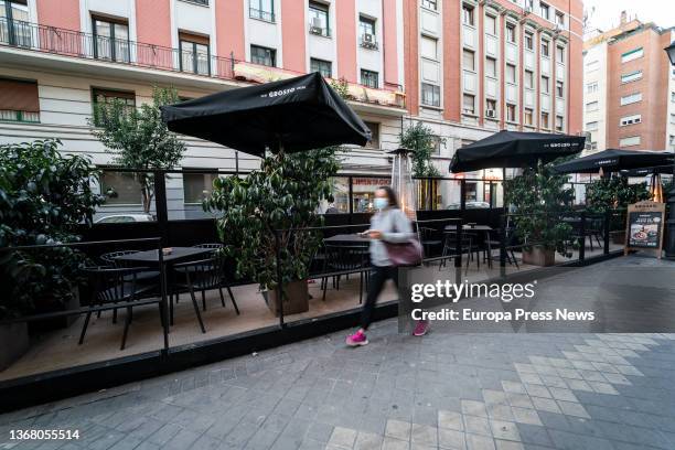 Woman passes by a terrace on Gaztambide street, on the same day that the modified Madrid Terrace Ordinance came into force, on Ponzano street, on...