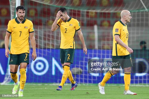 Mathew Leckie, Milos Degenek and Aaron Mooy of Australia look dejected after conceding their second goal during the FIFA World Cup Qatar 2022...