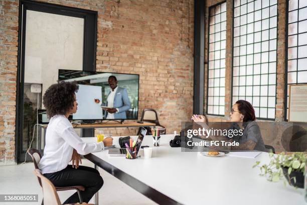 business team doing a video conference in the office - remote meeting stock pictures, royalty-free photos & images