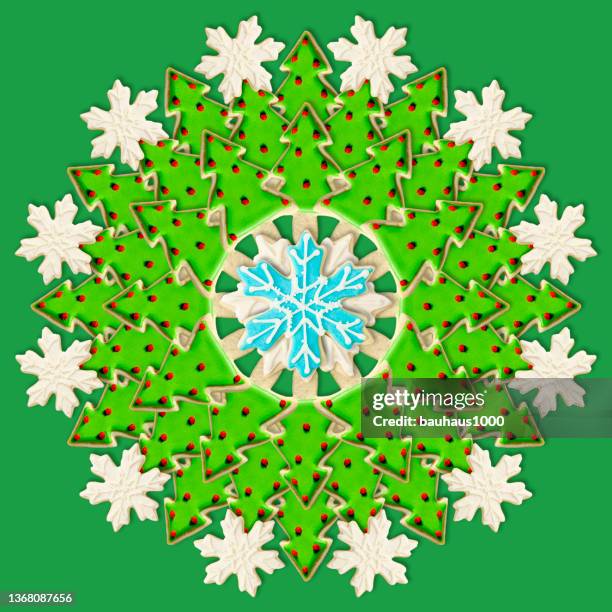 christmas tree and snowflake: christmas wreath created using festive decoratively iced christmas cookies - cookie decorating stock illustrations
