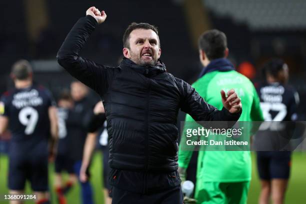 Luton Manager Nathan Jones celebrates with the fans after his team won the Sky Bet Championship match between Swansea City and Luton Town at...