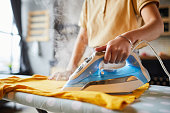 Young Woman Ironing Close Up