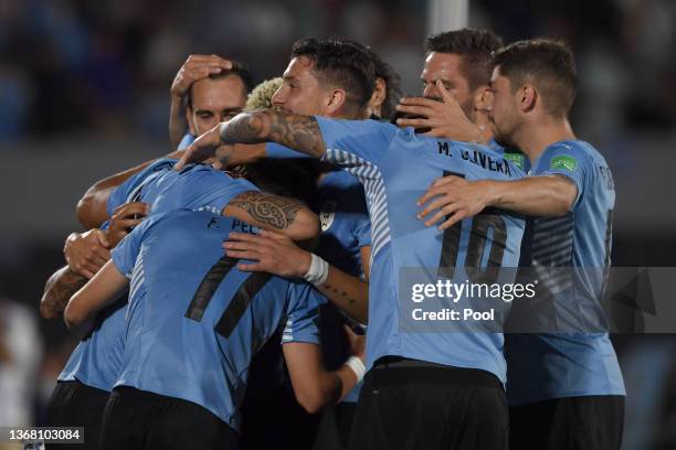 Giorgian De Arrascaeta of Uruguay celebrates with teammates after scoring the second goal of his team during a match between Uruguay and Venezuela as...