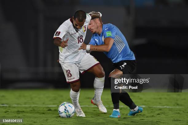 Romulo Otero of Venezuela and Jose Gimenez of Uruguay fight for the ball during a match between Uruguay and Venezuela as part of FIFA World Cup Qatar...