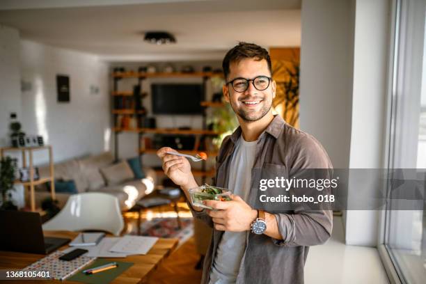 healthy lunch at home - young men stock pictures, royalty-free photos & images