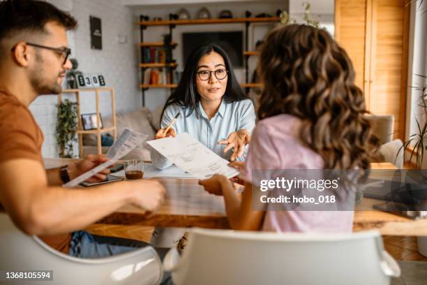 couple talking to finance advisor at home - budget 2021 stock pictures, royalty-free photos & images
