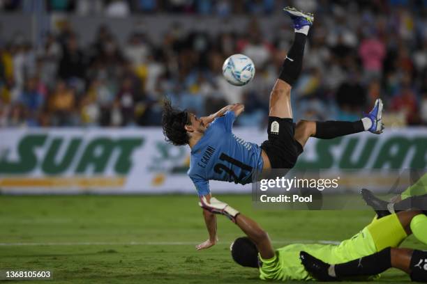 Edinson Cavani of Uruguay shoots to score the third goal of his team during a match between Uruguay and Venezuela as part of FIFA World Cup Qatar...