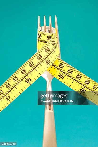 dieting, conceptual image - tape measure stock pictures, royalty-free photos & images