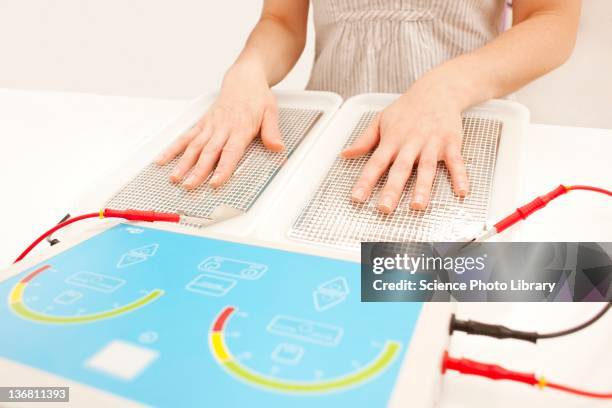 iontophoresis for excess sweating - iontophorese stock-fotos und bilder