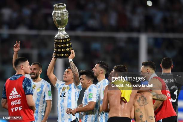 Lautaro Martinez of Argentina celebrates with the Copa America 2021 trophy after winning a match between Argentina and Colombia as part of FIFA World...
