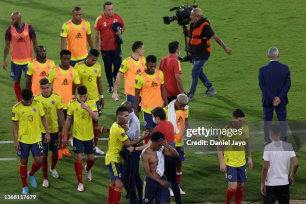 Radamel Falcao of Colombia leave the pitch with teammates Juan Cuadrado and James Rodríguez after losing a match between Argentina and Colombia as...