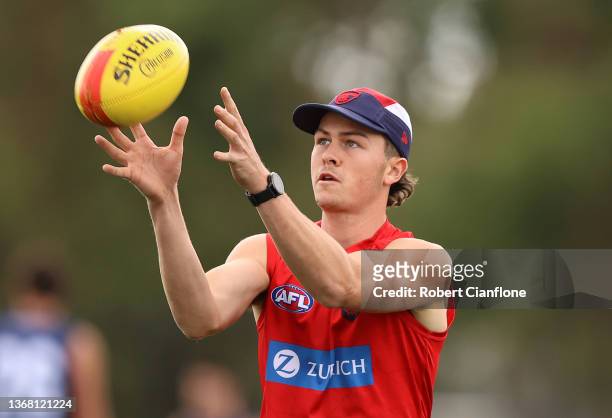Daniel Turner of the Demons takes the ball during a Melbourne Demons AFL training session at Casey Fields on February 02, 2022 in Melbourne,...