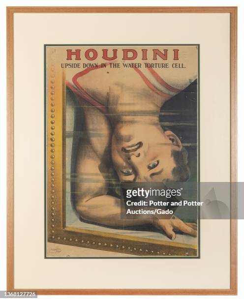 Harry Houdini Upside Down in the Water Torture Cell, London: Dangerfield, ca Close-up inverted bust portrait of Houdini submerged in the water tank...