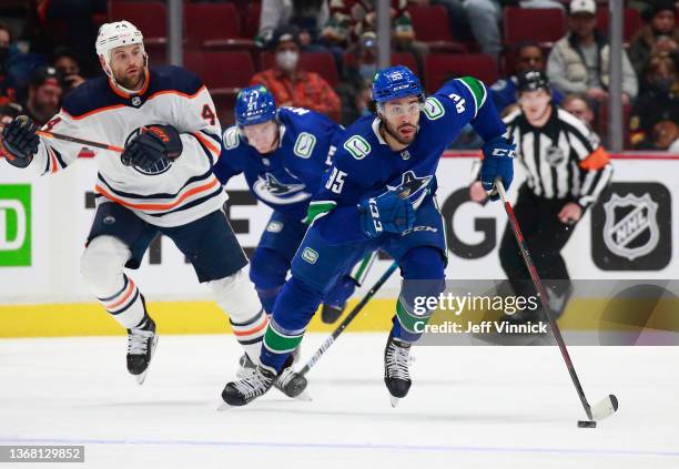 Justin Bailey of the Vancouver Canucks skates up ice during their NHL game against the Edmonton Oilers at Rogers Arena January 25, 2022 in Vancouver,...