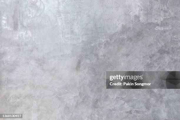 the background is a concrete texture that looks like an old grunge wall in a loft interior. - vignettering stockfoto's en -beelden