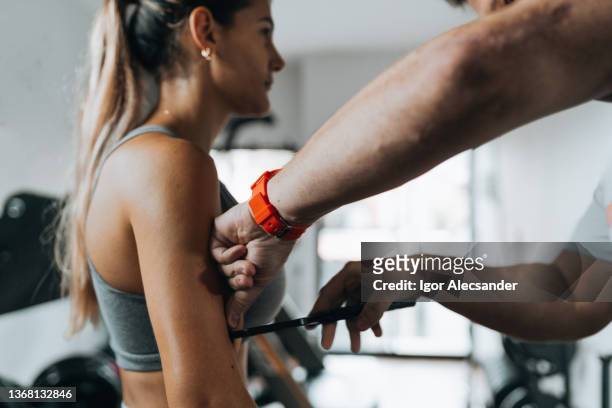 personal trainer measuring body fat index - bmi stage stock pictures, royalty-free photos & images