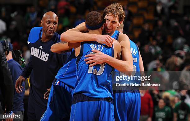 Dirk Nowitzki of the Dallas Mavericks hugs team mate Delonte West after the game win against the Boston Celtics on January 11, 2012 at the TD Garden...