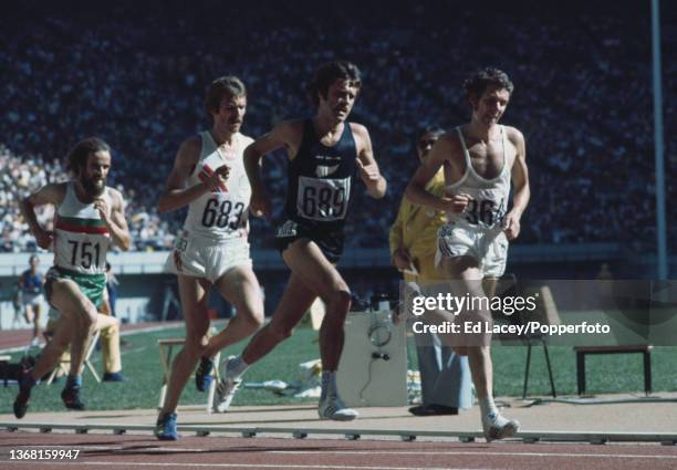 Brendan Foster of Great Britain leads Rod Dixon of New Zealand , Knut Kvalheim of Norway and Aniceto Simoes of Portugal to win heat 3 of the Men's...