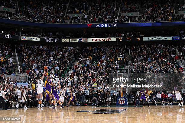 Devin Harris of the Utah Jazz gets his shot blocked in the last second of overtime by Kobe Bryant of the Los Angeles Lakers at Energy Solutions Arena...