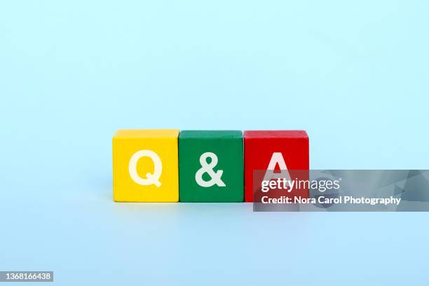 question and answer on wood block - letter q stock pictures, royalty-free photos & images