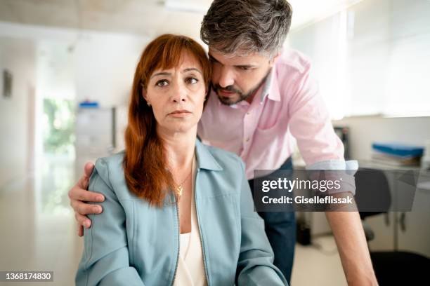 businesswoman being sexually harassed by her manager at work - harassment work stockfoto's en -beelden