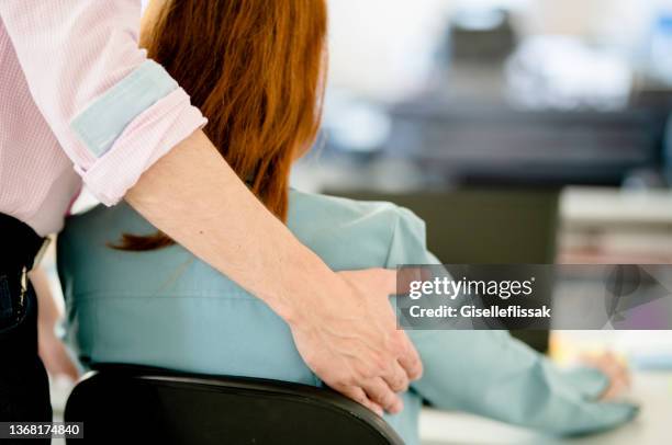 businessman sexually harassing a female colleague in an office - dismissal stock pictures, royalty-free photos & images