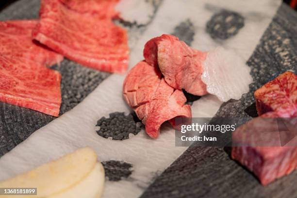 raw beef tongue wagyu beef meat in japanese yakiniku, bbq, grilled - different cuts of meat stock pictures, royalty-free photos & images