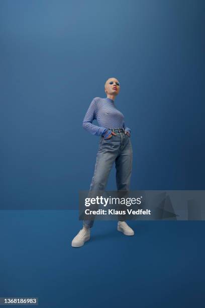 albino woman standing with hands in pockets - physical stance stock pictures, royalty-free photos & images