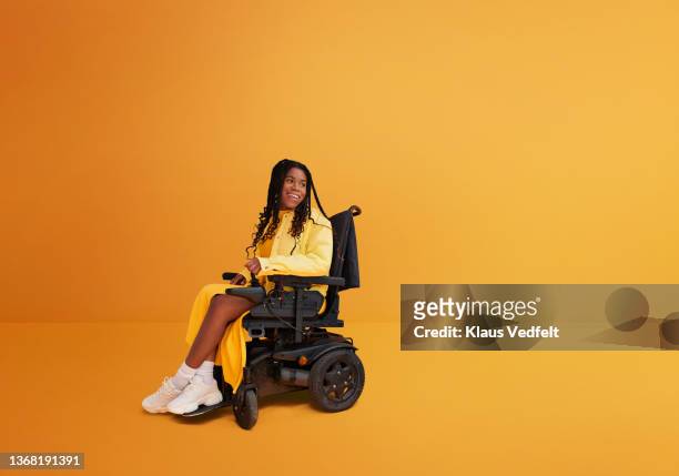 Smiling woman sitting in wheelchair