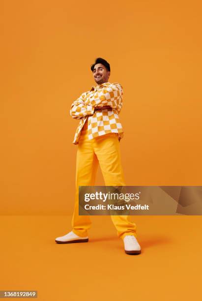 happy man with vitiligo standing with arms crossed - fashion men bildbanksfoton och bilder