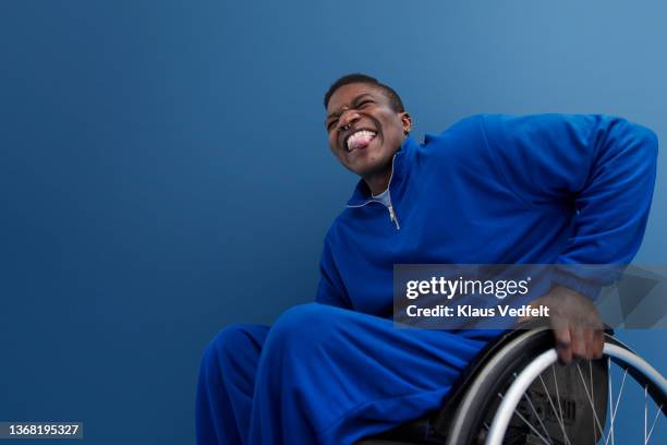 happy man with disability sticking out tongue - personal injury fotografías e imágenes de stock