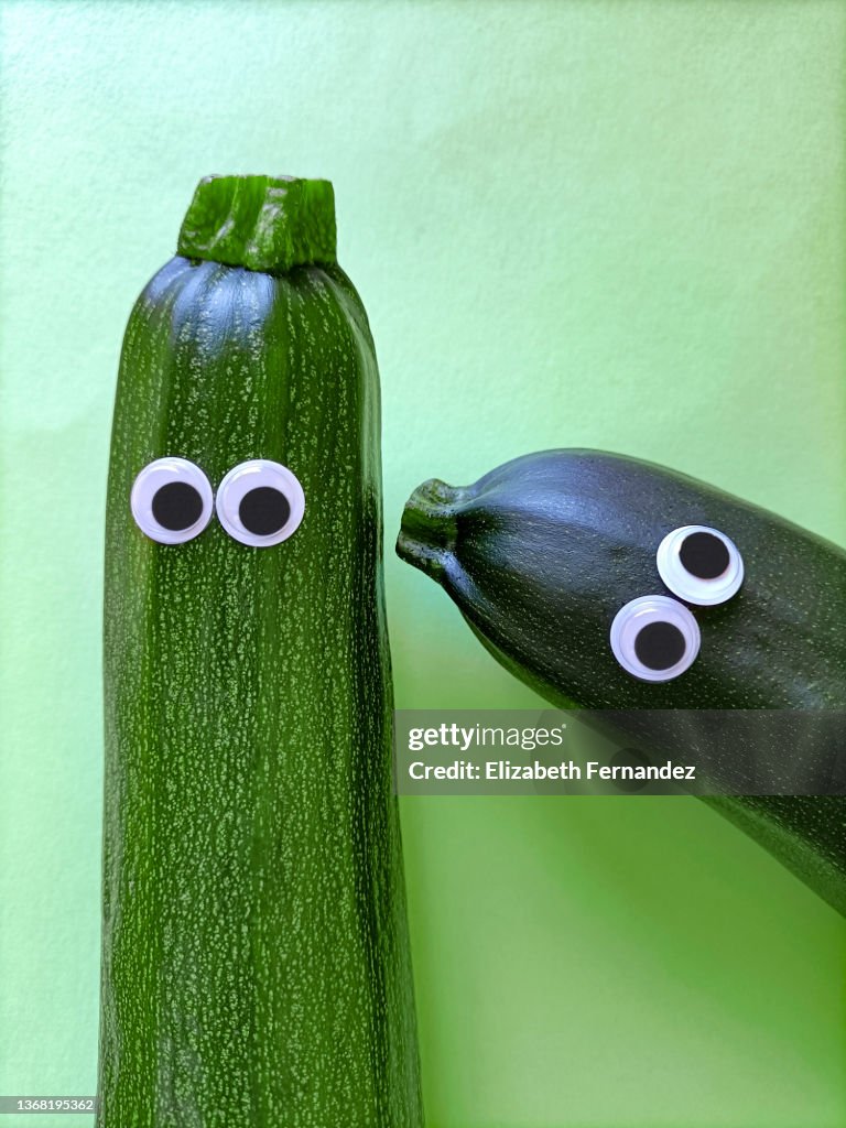Two Funny Zucchini With Cartoon Eyes On Green Background High-Res Stock Photo - Getty Images Two Funny Zucchini With Cartoon Eyes On Green Background High-Res Stock Photo - Getty Images
