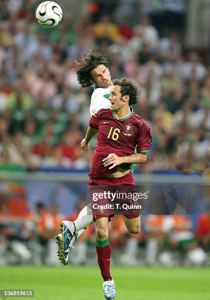 Jose Fonseca beats Ricardo Carvalho to a header during the Group D match between Portugal and Mexico at FIFA World Cup stadium Gelsenkirchen, Germany...